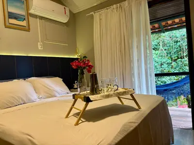 Uma cama ou camas num quarto em Casa pé na areia em condomínio com piscina