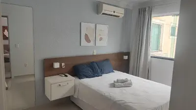 Uma cama ou camas num quarto em Aptos em Cond com Piscina e Academia próx da Praia - SBH