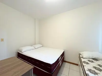 Uma cama ou camas num quarto em Seu Refúgio em Bombinhas Conforto e Vista do Mar