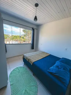 Uma cama ou camas num quarto em Apto 01 canto grande