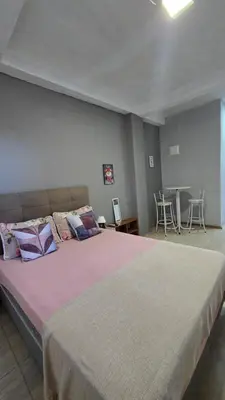 Uma cama ou camas num quarto em Residencial Zimbros 02