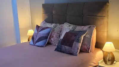 Uma cama ou camas num quarto em Residencial Zimbros 02