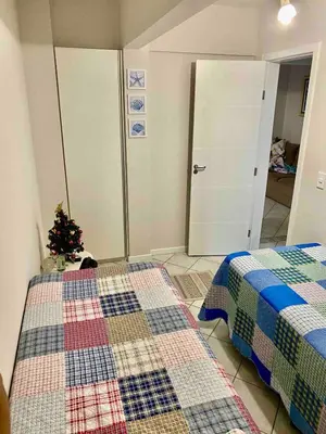 Uma cama ou camas num quarto em Apartamento aconchegante em Bombas