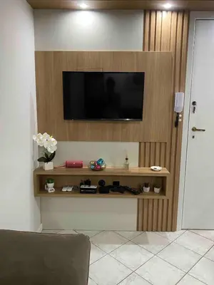 Uma televisão e/ou sistema de entretenimento em Apartamento aconchegante em Bombas