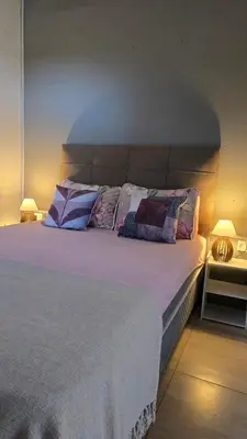 Uma cama ou camas num quarto em Residencial Zimbros 002