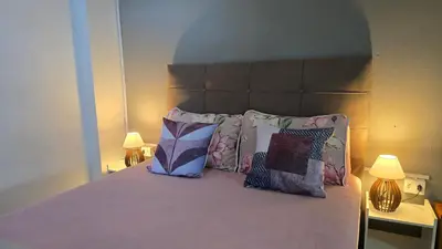 Uma cama ou camas num quarto em Residencial Zimbros 002