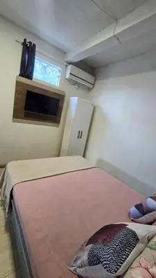 Uma cama ou camas num quarto em Residencial Zimbros 002