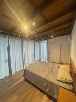 Uma cama ou camas num quarto em Black House