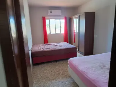 Uma cama ou camas num quarto em Casa para até 10 pessoas em Bombas, Bombinhas - SC