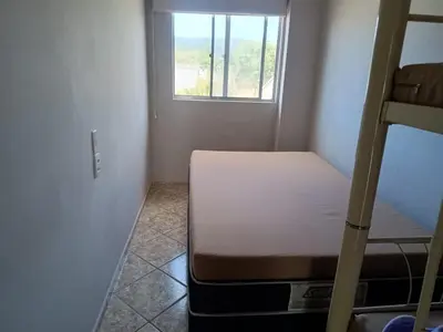 Uma cama ou camas num quarto em Casa para até 10 pessoas em Bombas, Bombinhas - SC