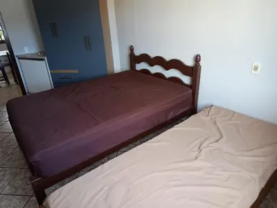 Uma cama ou camas num quarto em Casa para até 10 pessoas em Bombas, Bombinhas - SC