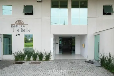 A fachada ou entrada de Apto prox a praia e com churrasqueira IBL103