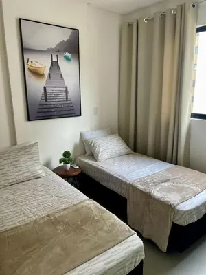 Uma cama ou camas num quarto em Vista mar lateral