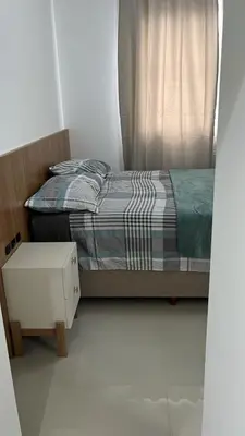 Uma cama ou camas num quarto em Apartment overlooking the ocean near the Central Beach
