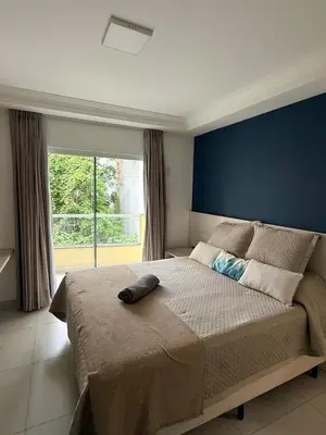 Uma cama ou camas num quarto em Hermoso Apartamento Meia Praia Itapema