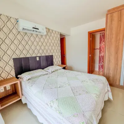 Uma cama ou camas num quarto em Bombas Apartamento
