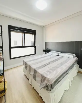 Uma cama ou camas num quarto em Apartamento AudiKar - Praia de Palmas