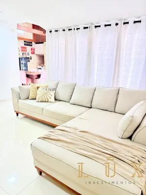 Uma área de estar em Casa Conforto e Estilo