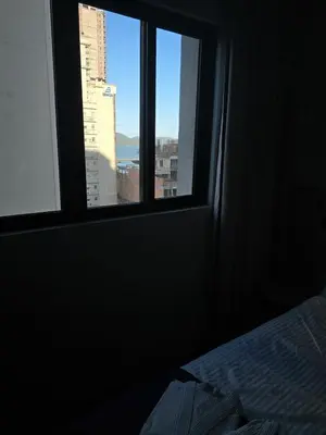 Uma cama ou camas num quarto em Flat Completo Meia Praia com piscina, área kids, sauna, próximo da praia e do Pier