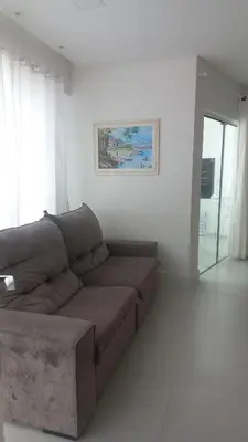 Uma área de estar em APARTAMENTO Pé NA AREIA ITAPEMA