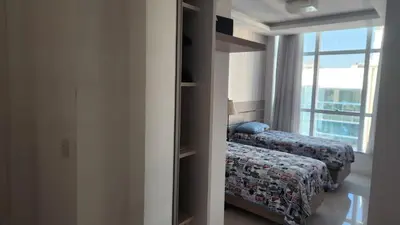 Uma cama ou camas num quarto em Apto 3 Suítes 3 garagens Vista Mar em Meia Praia