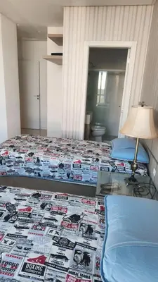 Uma cama ou camas num quarto em Apto 3 Suítes 3 garagens Vista Mar em Meia Praia