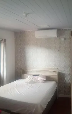 Uma cama ou camas num quarto em 600 metros da praia lugar lindo para família praia tranquilo pra nadar e ficar com a família