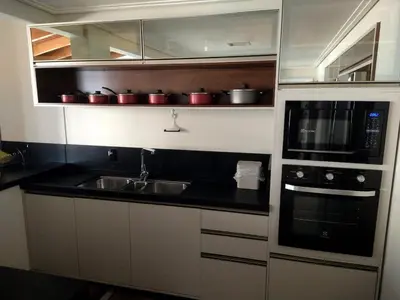 A cozinha ou kitchenette de apartamento Aconchegante 100 metros do mar