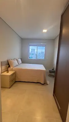 Uma cama ou camas num quarto em Apartamento vista mar na Praia de Palmas