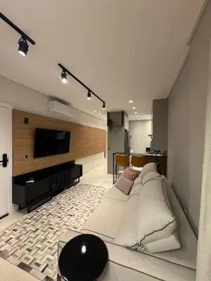 Uma televisão e/ou sistema de entretenimento em Apartamento com duas suítes próximo ao Hard Rock Café