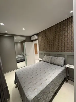 Uma cama ou camas num quarto em Apartamento com duas suítes próximo ao Hard Rock Café