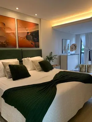 Uma cama ou camas num quarto em Cond Frente Mar Barra Sul Balneario Camboriu