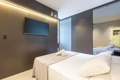 Uma cama ou camas num quarto em Vista para o Mar em Todos os Cômodos - 250m da Praia - Churrasqueira