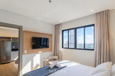 Uma cama ou camas num quarto em Apto a 300m da Praia em prédio c/ piscina FNK1905