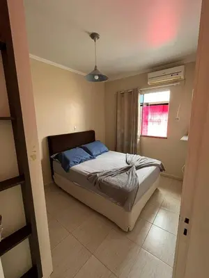 Uma cama ou camas num quarto em Casa 3 dormitórios Praia de Bombas
