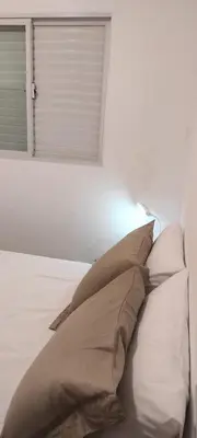 Uma cama ou camas num quarto em Casa de Praia Aconchegante