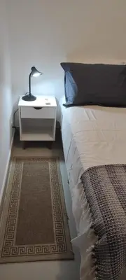 Uma cama ou camas num quarto em Casa de Praia Aconchegante