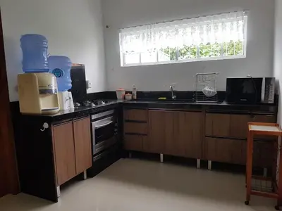 A cozinha ou kitchenette de Casa de Praia Aconchegante