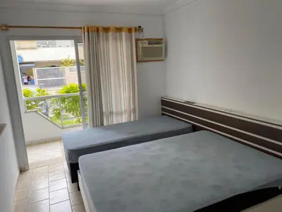 Uma cama ou camas num quarto em Residencial Pequena Sereia