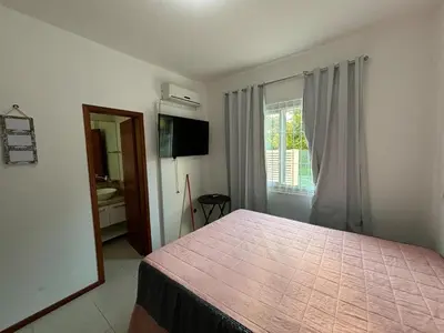 Uma cama ou camas num quarto em Apartamento SanKat - Praia de Palmas