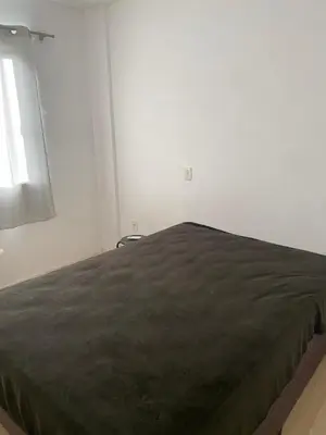 Uma cama ou camas num quarto em Apto Morretes
