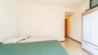 Uma cama ou camas num quarto em Sobrado A 3 quartos Canto Grande