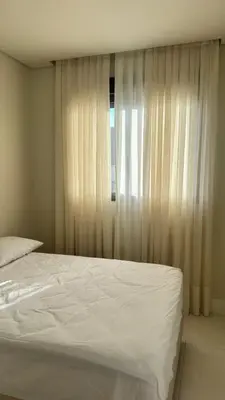 Uma cama ou camas num quarto em Cobertura Sonho de Palmas