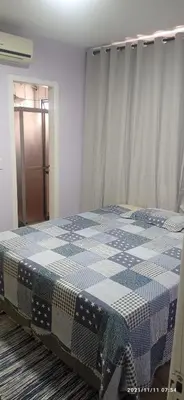Uma cama ou camas num quarto em Itapema