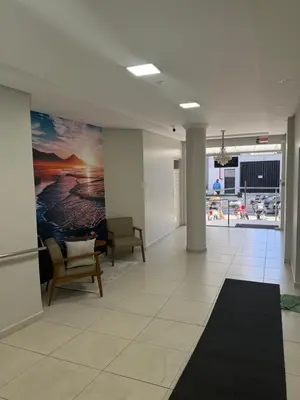 Uma televisão e/ou sistema de entretenimento em Cobertura frente mar em Itapema