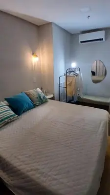 Uma cama ou camas num quarto em Flat Itapema