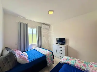 Uma cama ou camas num quarto em Doce Lar