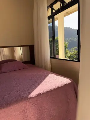 Uma cama ou camas num quarto em Casa Brisa do Mar