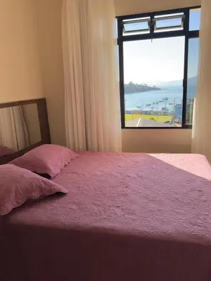 Uma cama ou camas num quarto em Casa Brisa do Mar