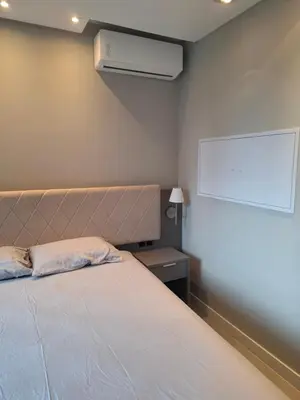Uma cama ou camas num quarto em Flats em ótima localização